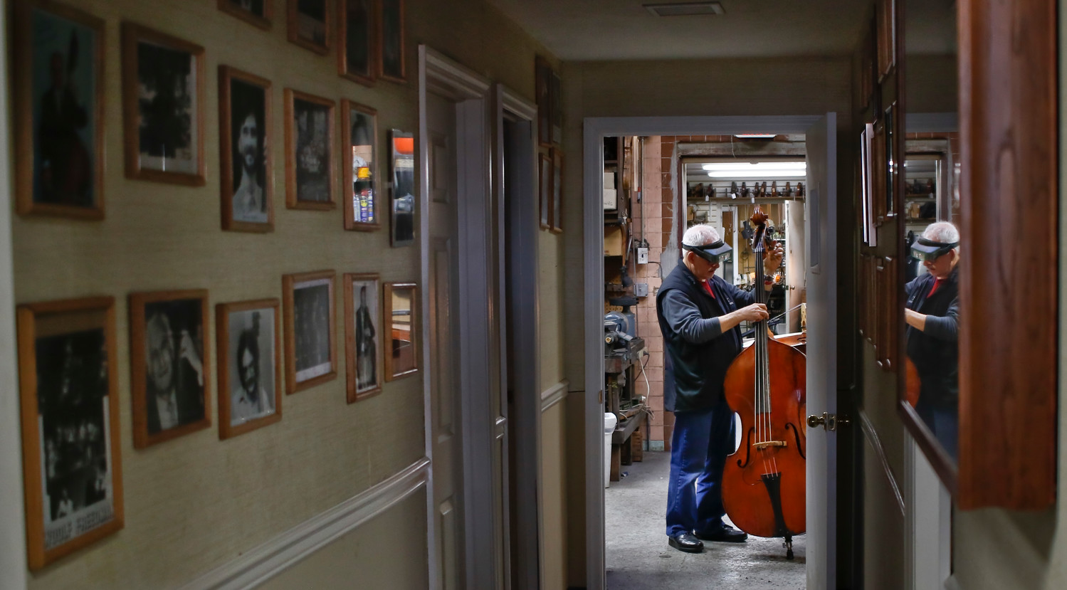 Jake Cradilas, a shop foreman who has worked at Kolstein’s for nearly 25 years, gave a newly repaired bass its final evaluation.
