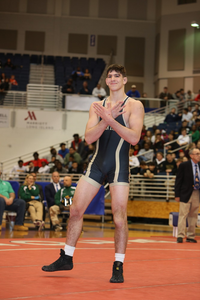 Loew was all smiles after earning his second county championship, and posed for the cameras that surrounded the mat.