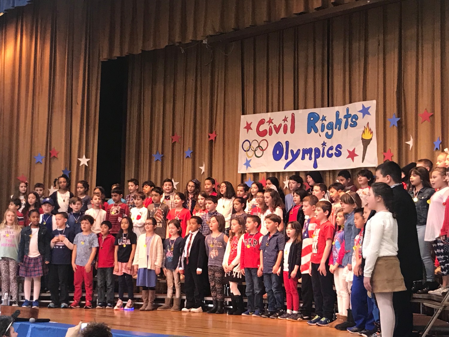 Marion Street School third-graders performed songs and skits in the Civil Rights Olympics, and presented visitor Joseph McNeil with a gold medal at the end of their performance. McNeil was part of the Greensboro, N.C. sit-ins at Woolworth’s, in protest of segregation in 1960
