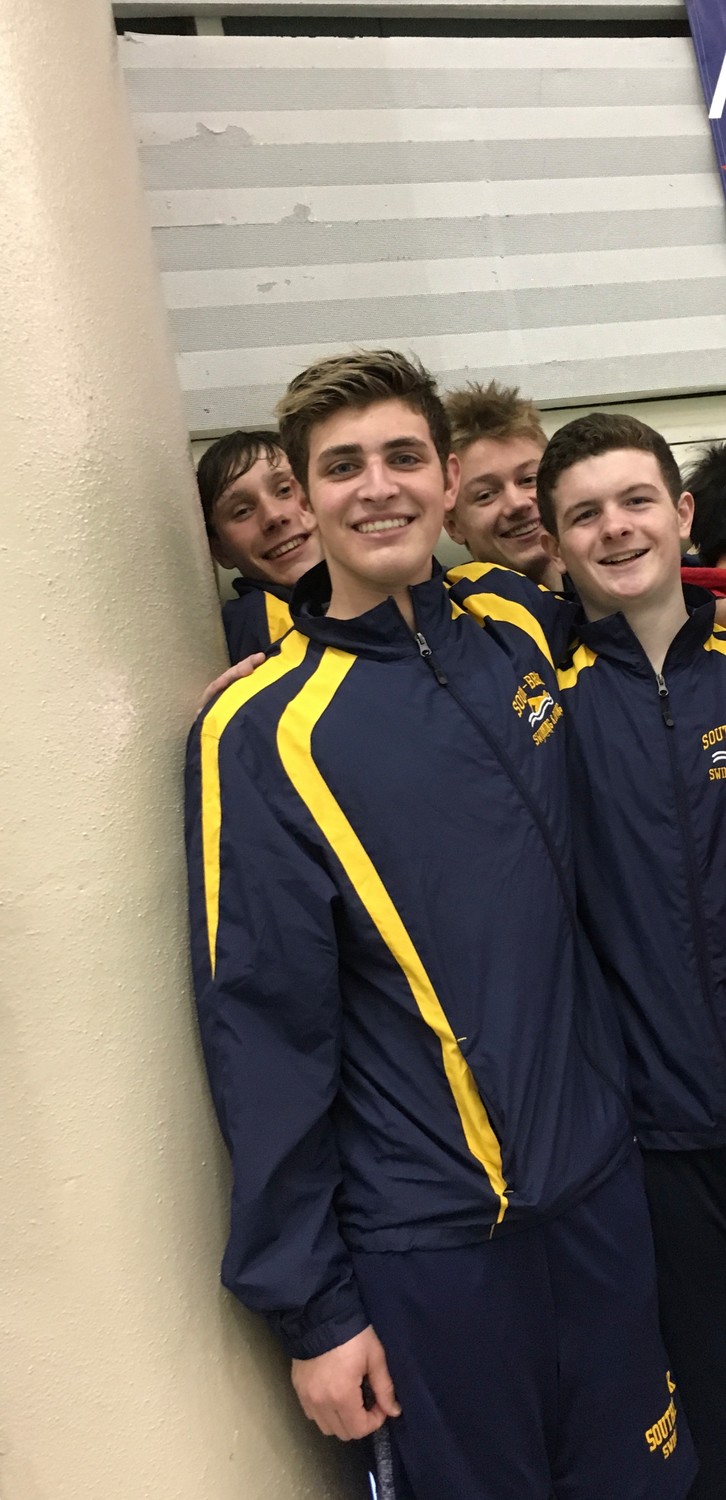 Timothy Marski, left, Daniel Dalrymple, Ryan Davidoff and Kyle Bergin set a county record at the Nassau boys’ swimming championships on Feb. 10 with a 200-yard medley relay time of 1:35.72.