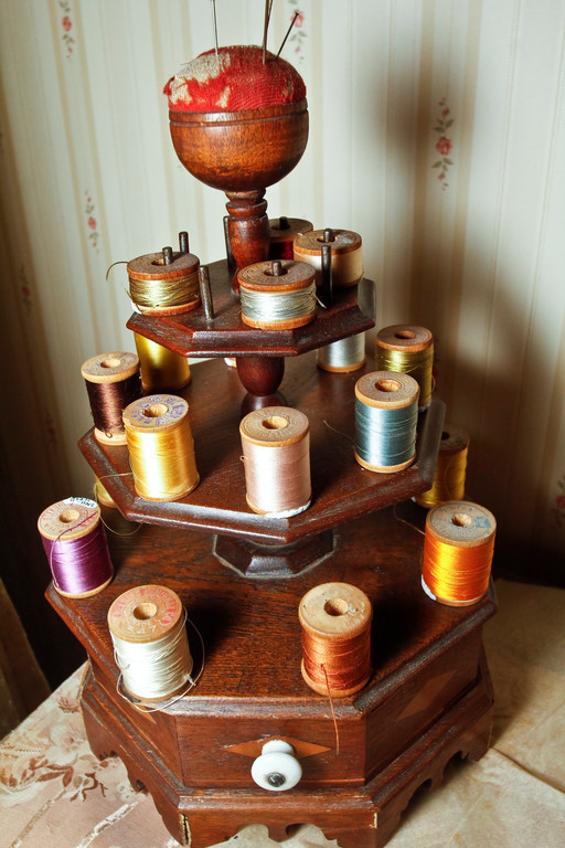 Various colored spools in the sewing room.