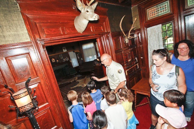 The students were fascinated by Teddy's Library during their tour.