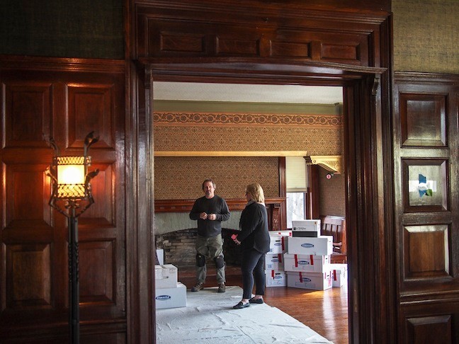 March 2015. Sue Sarna, curator of Sagamore Hill and project manager, speaks with Craig Oleszewski, Sr. Exhibit Specialist for National Parks Svc. N.E. Region in TR's Library during the restoration. Items are being unpacked and put back where they belong.