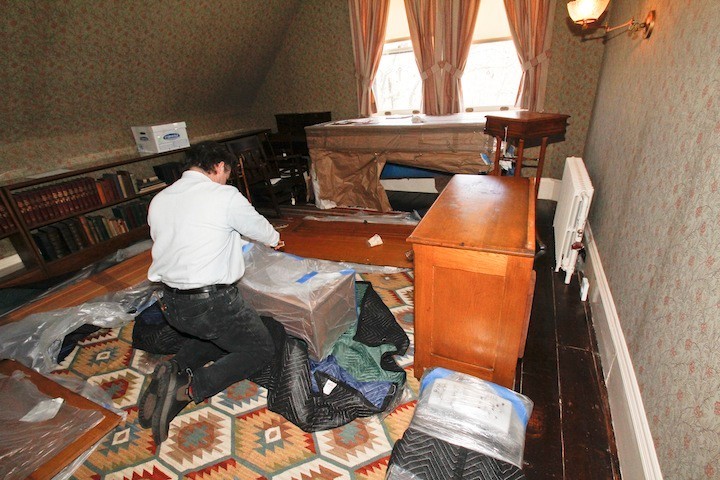 George Hagerty unpacks some of the furniture for TR Juniors ROom