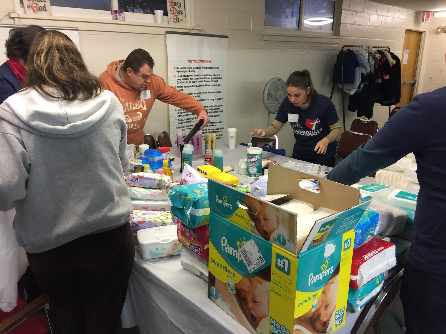 Courtesy of the church of St Jude.
Volunteer Steven Reichert and Volunteer Coordinator Erica Parrinello, at left, wsorted through donations at the Mother and Child Ministry.