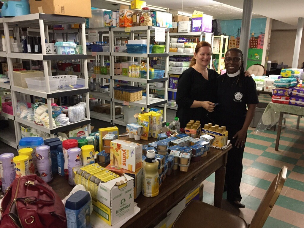 Barbara Rice Thompson, program director of the Mother and Child Ministry, left, and the Rev. Maxine Barnett, curate at the Church of St. Jude, inside the stocked pantry.