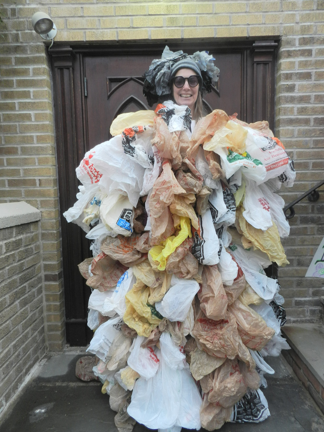 Environmental activist Susan Brockmann, of Lynbrook, wore a “dress” made of 500 single-use bags, the number of bags the average person uses in a year.