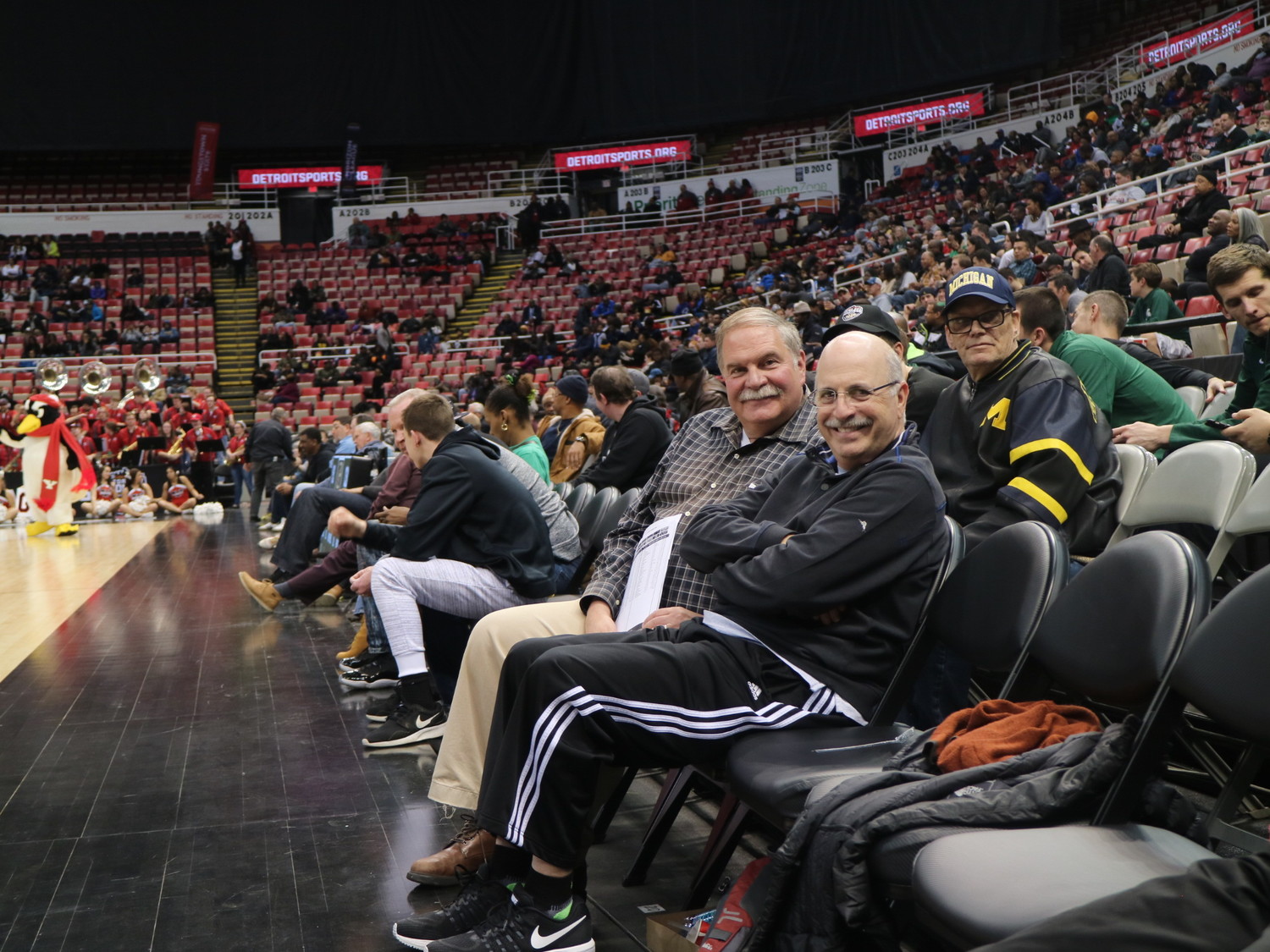 Local resident Ned Hirsch, left, with his friend Bill Rosenthal at the Horizon League Tournament in Detroit, has seen 327 Division I college basketball teams play.