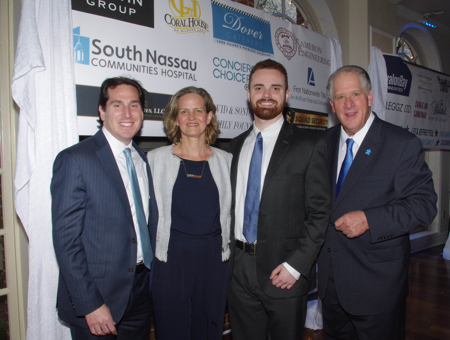 State Sen. Todd Kaminsky, left, Nassau County Executive Laura Curran, resident Sean Culkin, who was presented with the Courage Award and Tony Cancellieri, co-founder of RVC Blue Speaks.