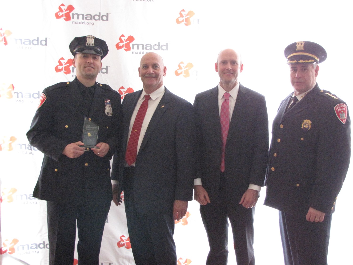 Freeport Police officer Alan Moreno, far left, accepted his award from MADD Executive State Director Richard Mallow, Chief Government Affairs Officer J.T. Griffin and Freeport Police Chief Miguel Bermudez.