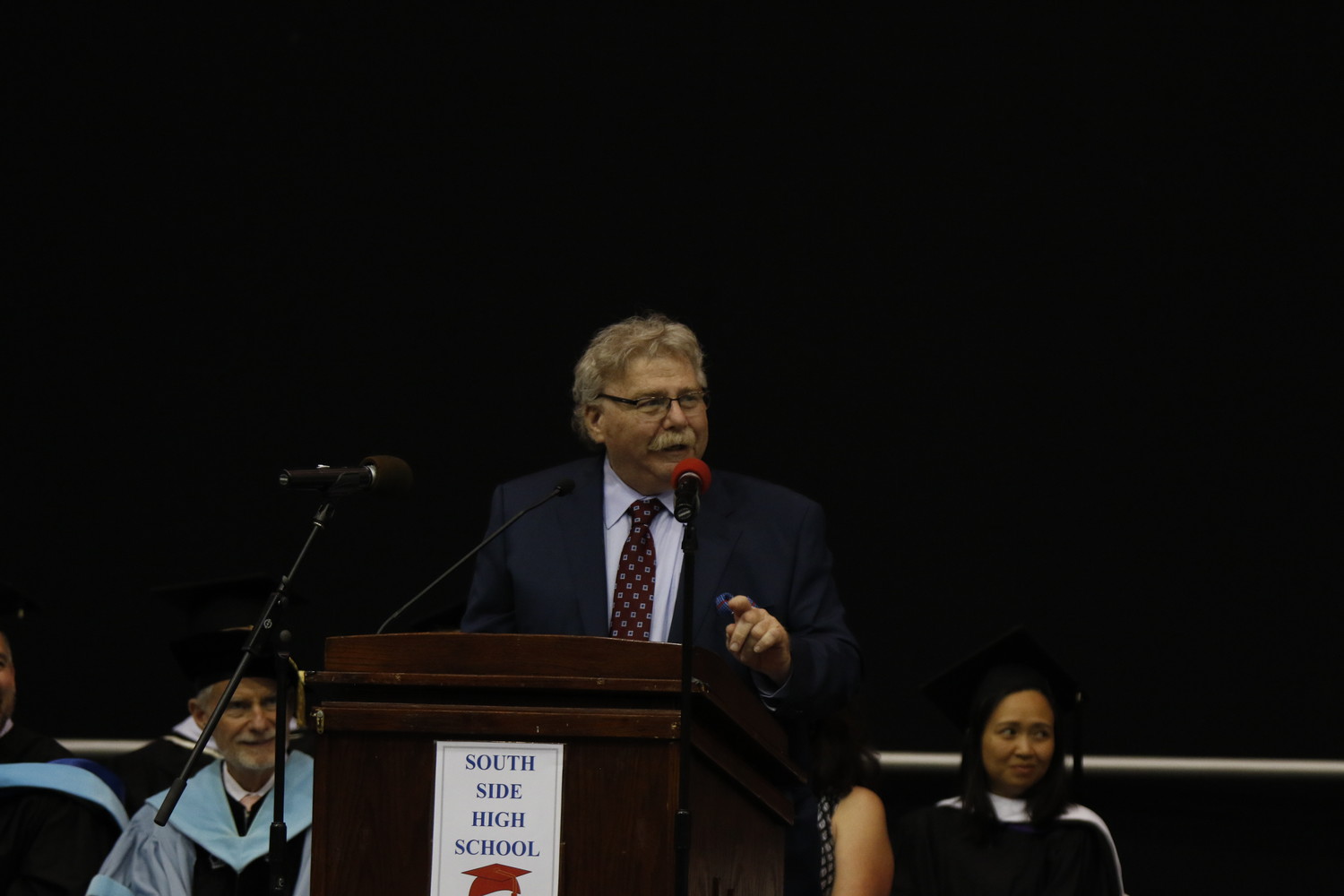 Mark Masin, pictured at last year's South Side High School graduation, decided not to run for re-election after 15 years on the Board of Education.