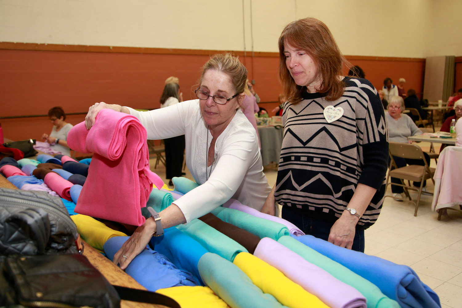 Marilyn Jurgensen and Mary Ann Grandazza arranged the blankets in a colorful way.