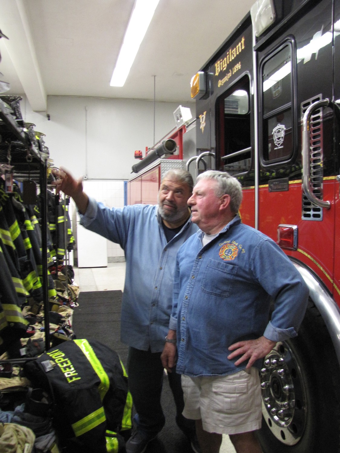 Though retired from their careers, Freeport firefighters Anthony Basile, left, and Edward Martin continue to volunteer with the department as mentors and supporters of younger firefighters.