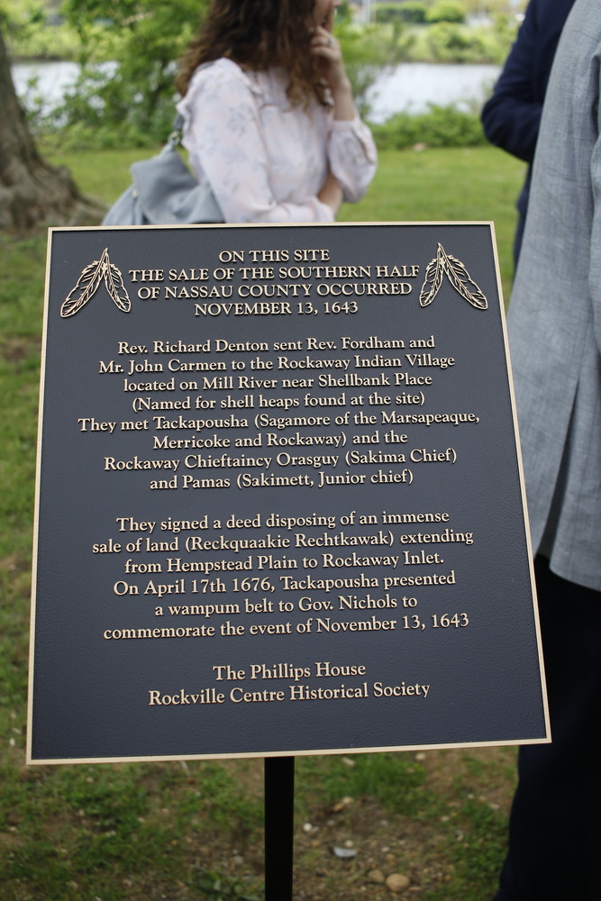 The plaque preserves the memory of when Tackapousha, chief of the Marsapeaque tribe, presented Governor Richard Nicoll with a wampum belt on November 13, 1643 — the day the deed was signed for the transfer of land, which included Rockville Centre.