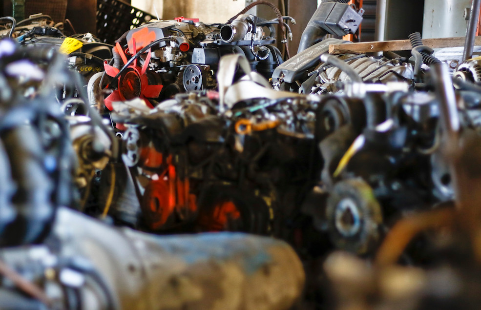 A collection of engines sits in the back of one of the shop rooms.