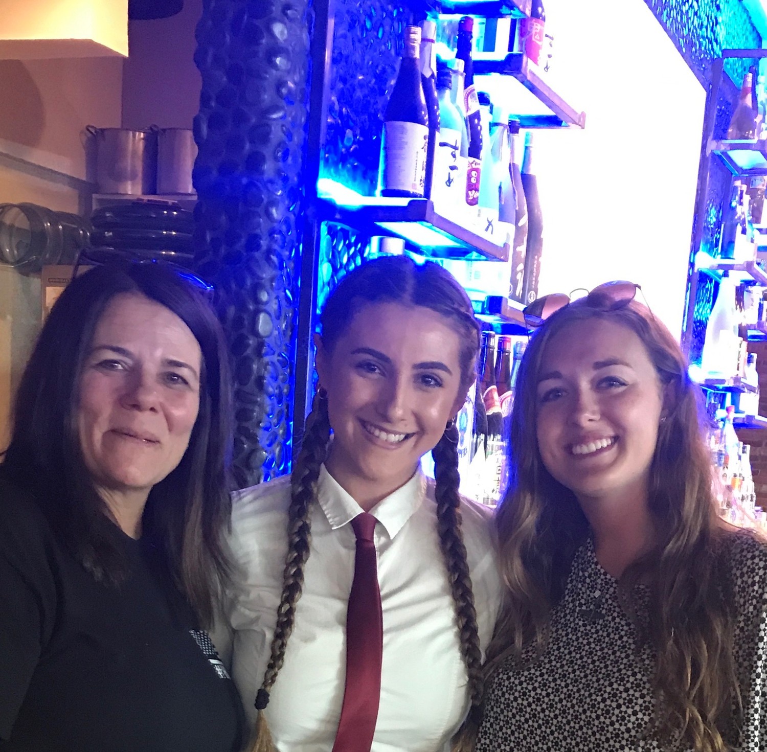 Suzanne Coletta-Knab, left, and her friend Jayden Lancaster, right, with Stephanie D’Agostino, a graduate of Marjory Stoneman Douglas High School in Parkland, Fla., whose brother was at the school during the shooting. Coletta-Knab gave D’Agostino #Honor17 bracelets in memory of Parkland survivors.