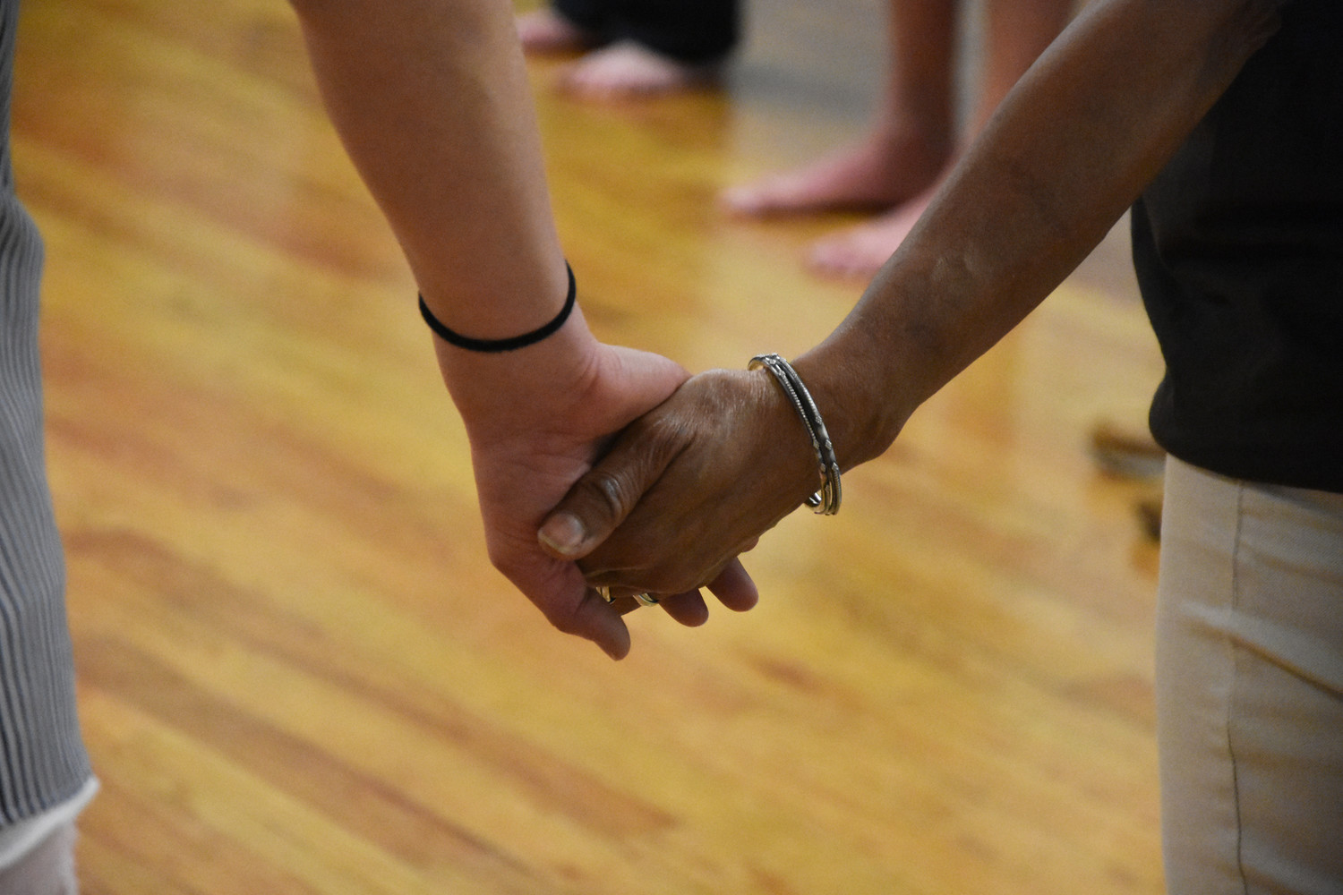 The dancers held hands with friends and strangers.