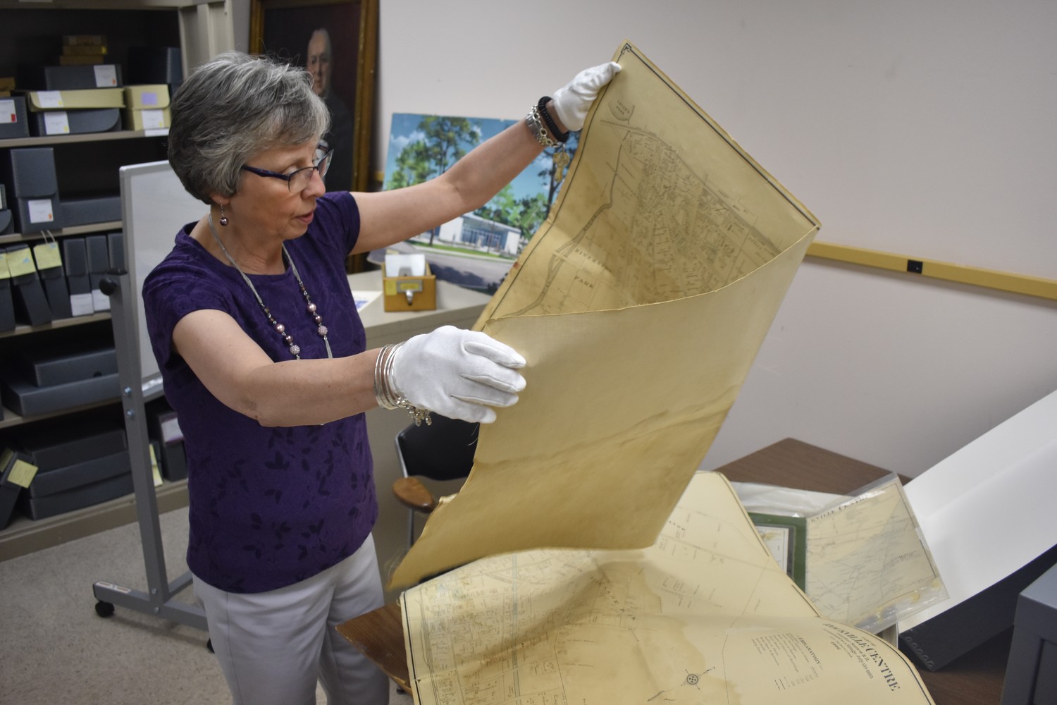 Alene Scoblete, the Rockville Centre Public Library’s archivist and local history librarian, analyzed a 1906 map of Rockville Centre in the facility’s basement.