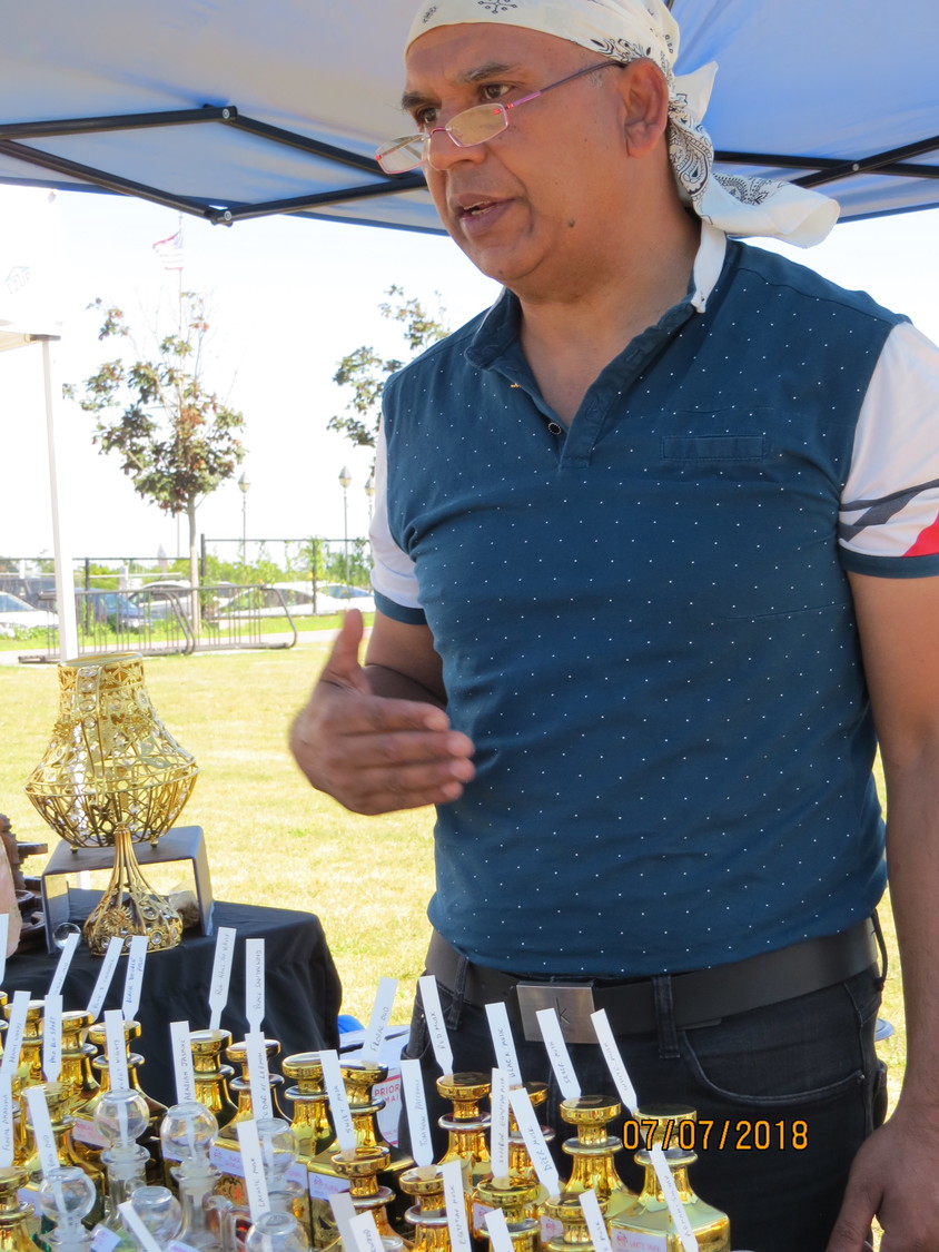 Summer Sea Breeze Park Expo vendor Sohail Nashir, owner of Arabian Scent Castle, oversaw his table of oil-infused perfumes on July 7.