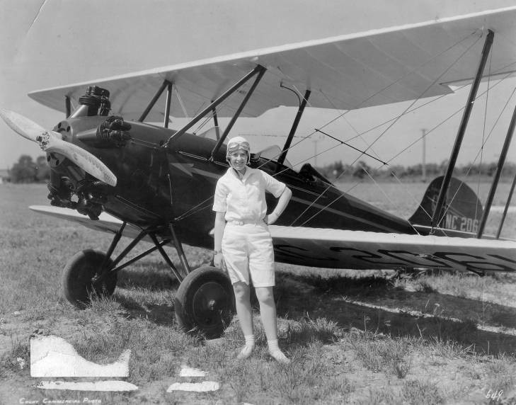 Smith with the Bellanca plane in which she set an endurance record of 26 1/2 hours in the air in 1929.