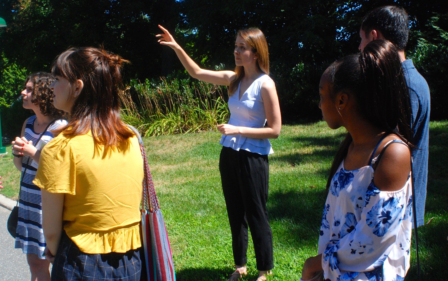 Katarina Meze, center, a doctoral student at Cold Spring Harbor Laboratory’s Watson School of Biological Sciences, recently led Herald staffers and interns on a tour of the 117-acre lab. Listening in were, from left, interns Zoe Malin, Alicia McGowan, Nia Matthews and Justin Zion.