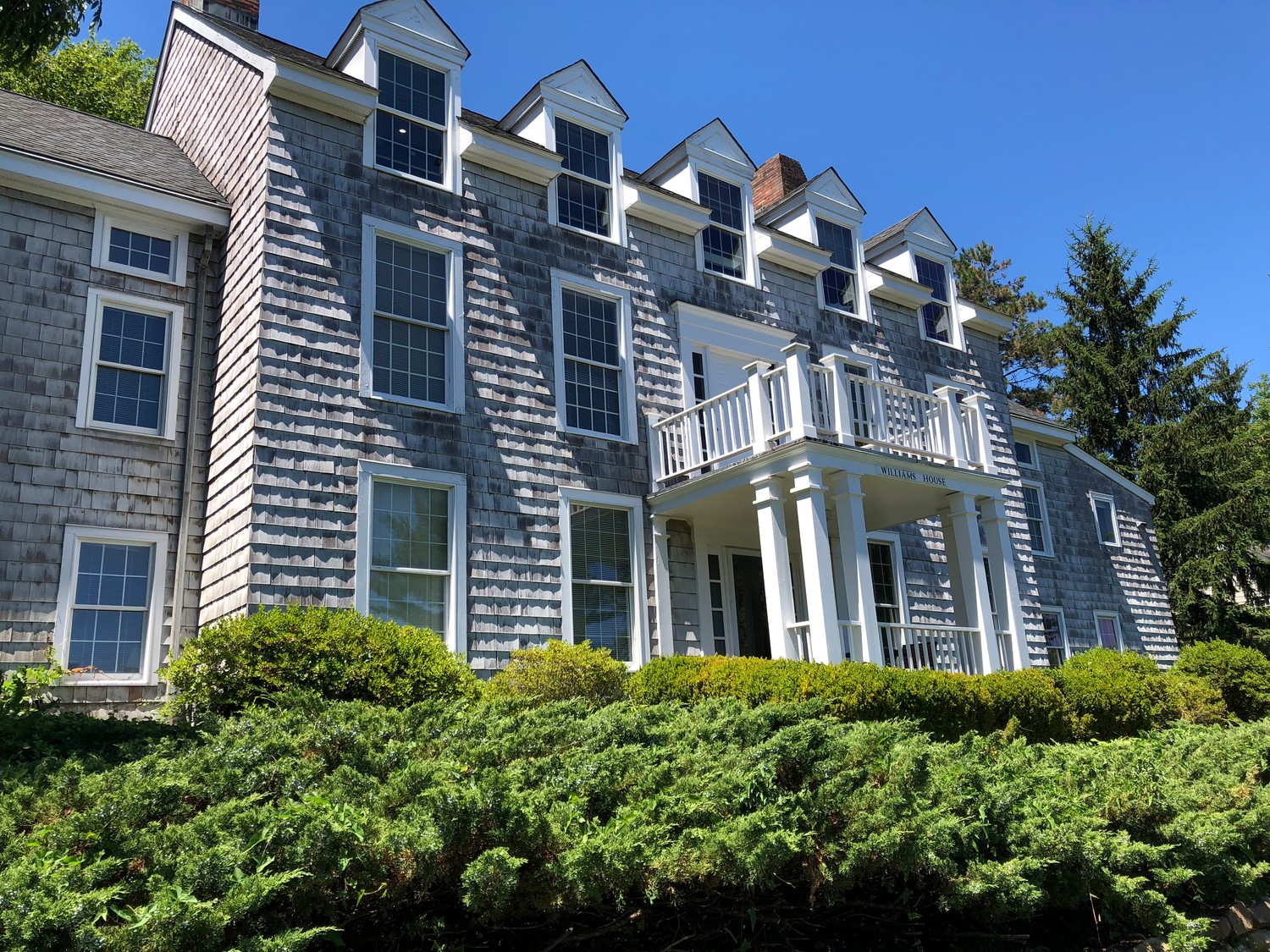 Many of CSHL's buildings look like they belong in a New England fishing village. Above, Williams House.