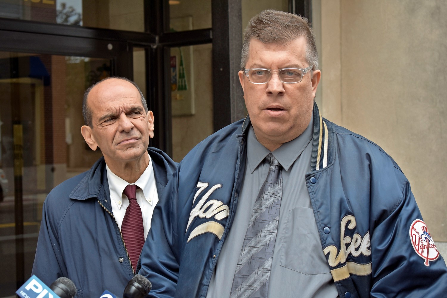 Thomas McGarvey, right, who received $500,000 through the Diocese of Rockville Centre’s Independent Reconciliation and Compensation Program, is one of 161 clergy sex abuse victims who have been paid settlements so far. Boston attorney Mitchell Garabedian, left, represented him.