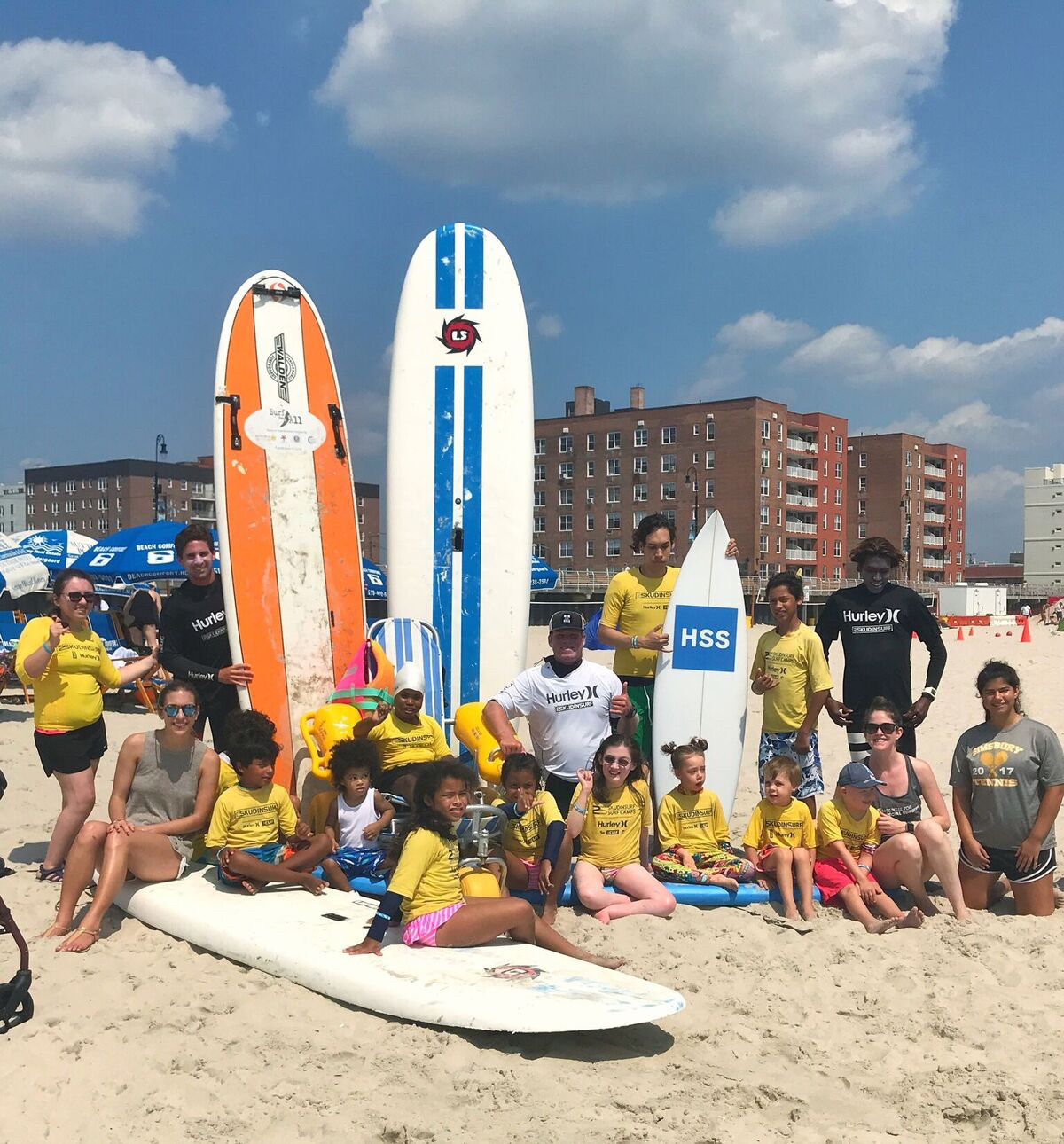 A group of patients from the Hospital for Special Surgery teamed up with Long Beach surf instructors from Skudin Surf for a day of fun.