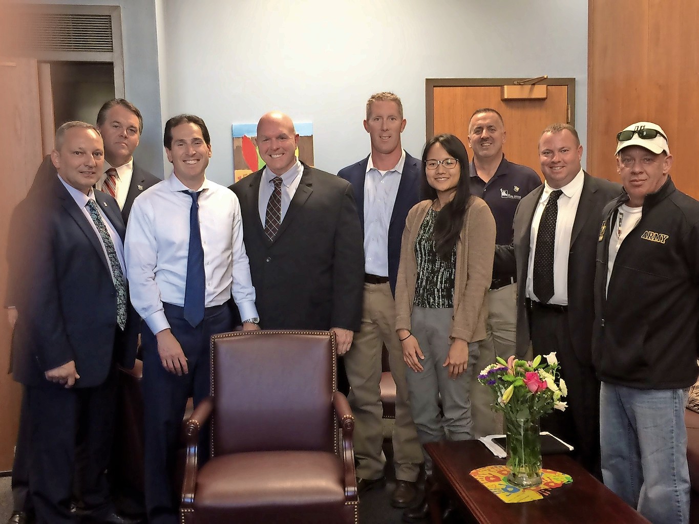 Rockville Centre Detective Chris O’Connor, second from right, with, from left, Pat Saunders, of the Suffolk County PBA; Matt McCauley; State Sen. Todd Kaminsky; Suffolk County police officers Tom Wilson and Scott Bowe; Dr. Stephanie Wu; and Anthony Flammia and John Feal, of the FealGood Foundation.