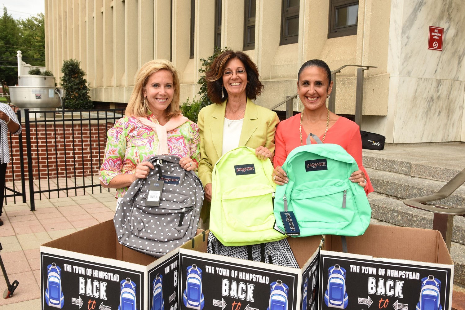 Hempstead Town Supervisor Laura Gillen (left), President and CEO of Island Harvest Food Bank Randi Shubin Dresner (middle), Town Clerk Sylvia Cabana (right) hope to collect 700 new backpacks for the Town of Hempstead’s Kids Weekend Backpack Collection Drive.