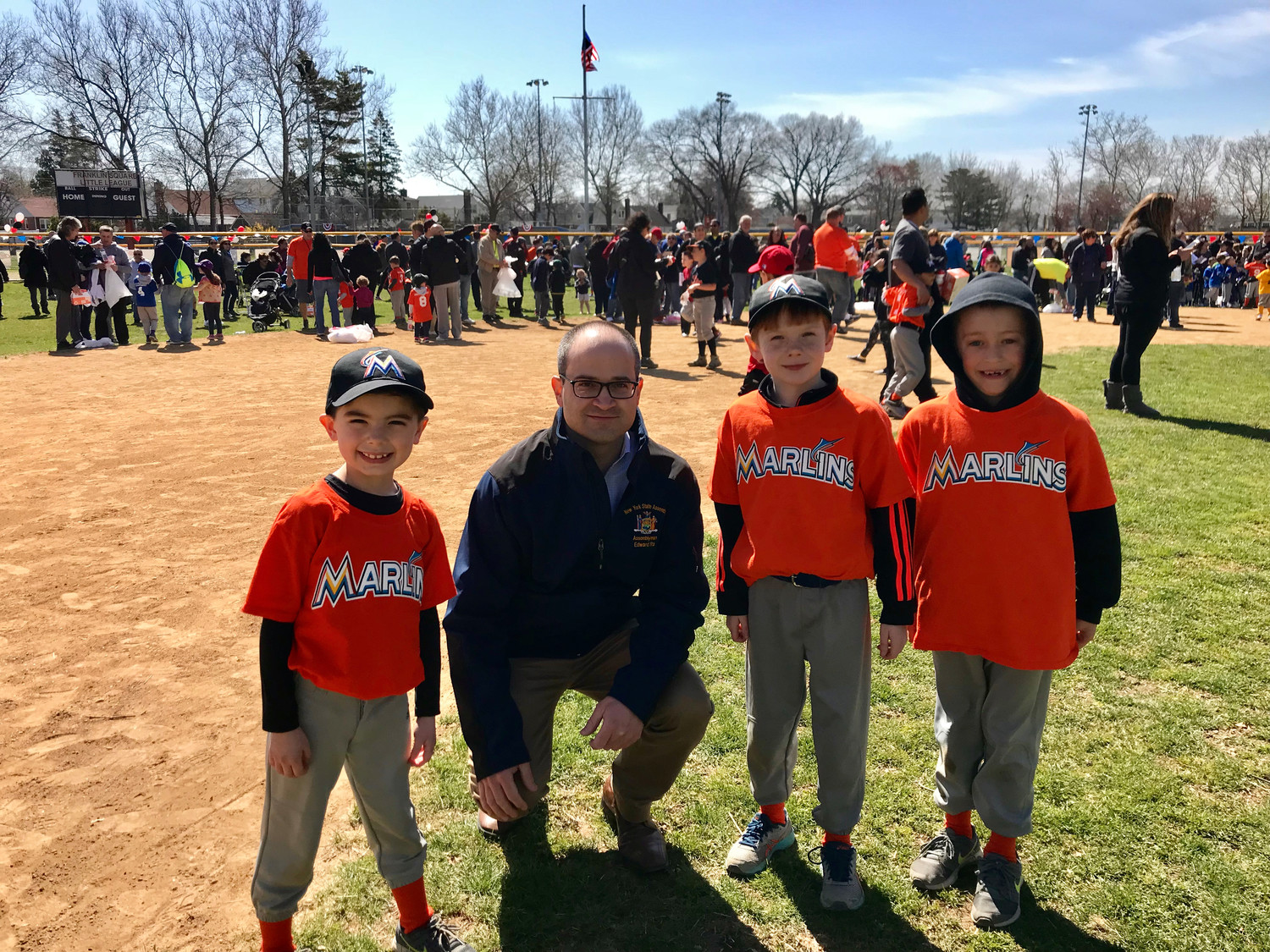State Assemblyman Edward Ra, who is running for re-election, with three members of the Franklin Square Marlins Little League team earlier this year.