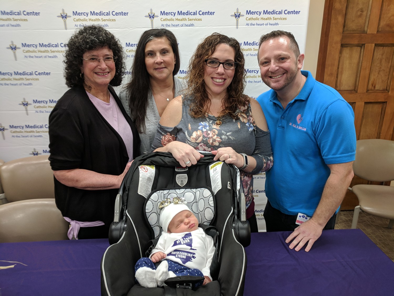 Mercy Medical Center nurse Barbara Weiss, left, joined fellow nurse Melissa Calvo, Jennifer Williams and Dr. Neal Bellin last Friday as they wished farewell to Williams and her newborn daughter, Leilah Faith Williams, before they headed home to North Carolina.