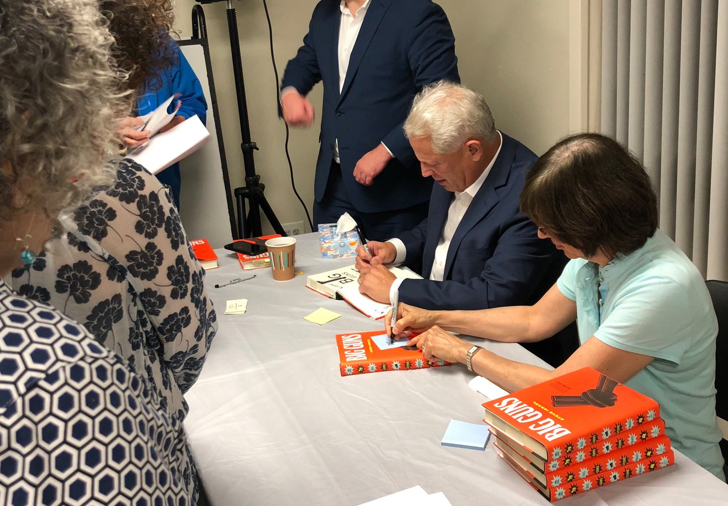 The Gold Coast Library was visited by former congressman Steve Israel, seated, who gave a lecture on his new book, answered questions from readers and signed copies.