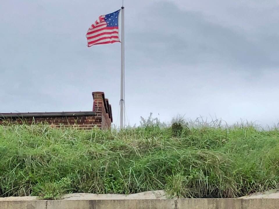 The Star-Spangled Banner, the flag, flying high above Fort McHenry.