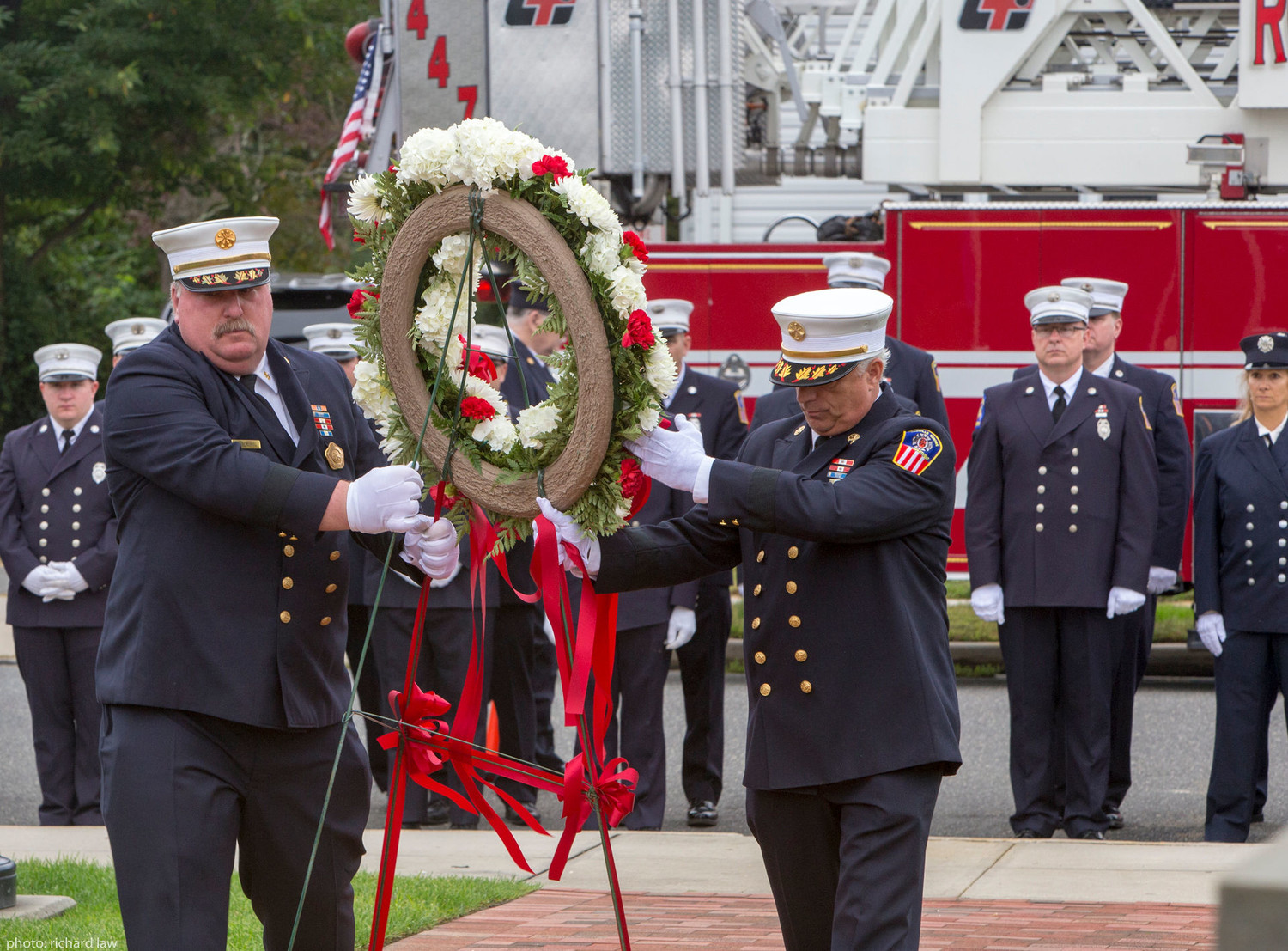 Rockville Centre fire chiefs Eric Burel and James Avondet carried a wreath to the memorial.