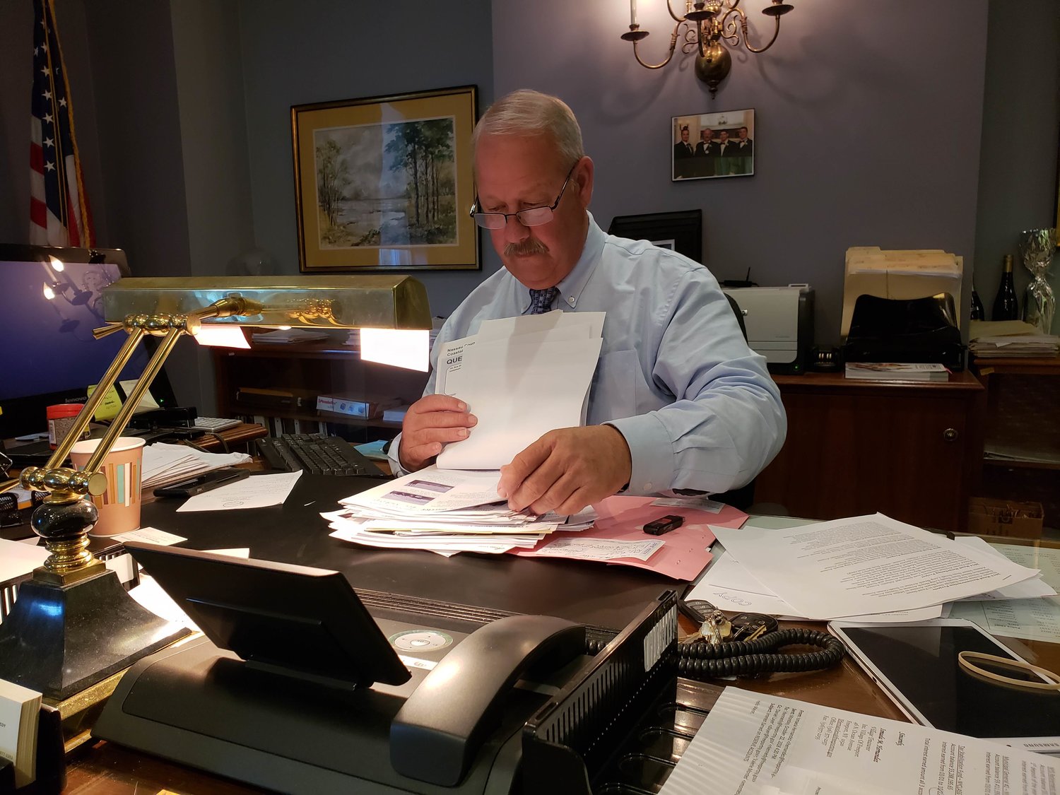 Freeport Mayor Robert Kennedy reviewed paperwork detailing current and upcoming storm resiliency projects in the village.