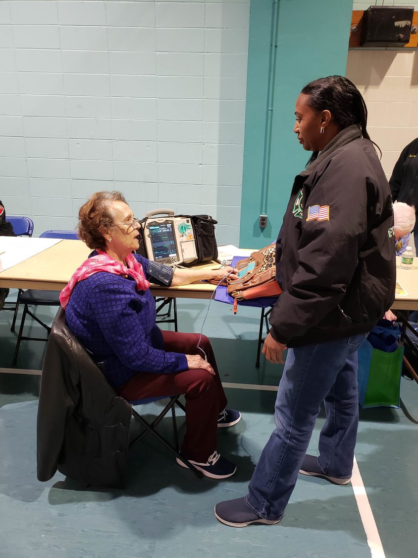 Freeport Fire Department’s fire medic, Debbie Hopkins, right, took Sivita Marciano’s, 79, blood pressure during the health fair.