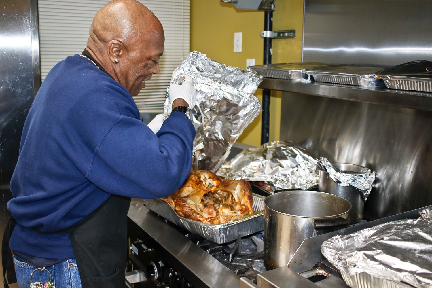 Melvin Lewis prepared eight turkeys, ham and 40 pounds of roasted potatoes for the community dinner.