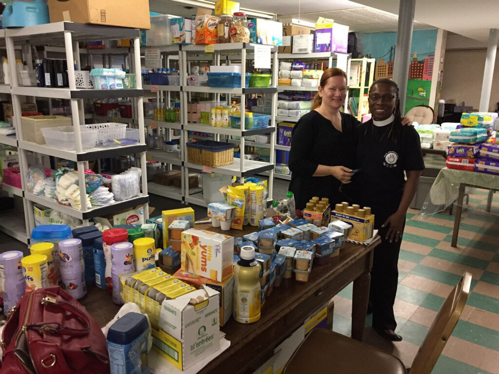 Barbara Thompson, program director of the Mother and Child Ministry, left, and the Rev. Maxine Barnett, curate at the Church of St. Jude, inside the stocked pantry.