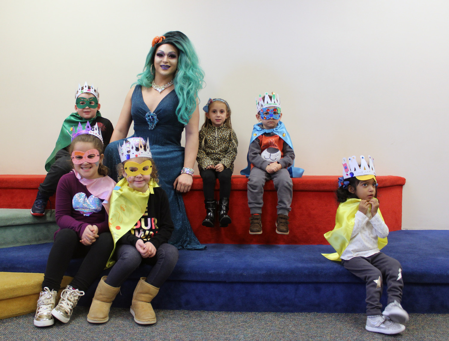 After reading several books about tolerance and inclusivity, Noche complimented children as they created their own crowns and superhero capes and masks. From left were Aiden O’Callaghan, 5, Angelina and Viviana Frisch, 6 and 4, Olivia Longo, 4, Xazar Karimou, 4, and Leilani Grant, 3, all of East Meadow.