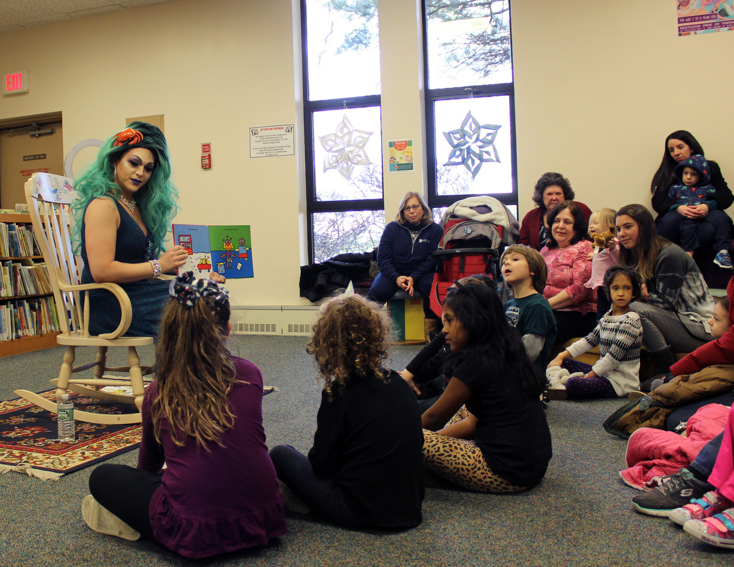 Bella Noche read several books at Drag Queen Story Hour at the East Meadow Public Library on Jan. 12, including “Love the World,” about loving the environment, others and oneself. “Does everyone here love themselves?” she asked before starting the book. “It’s important to love yourself.”