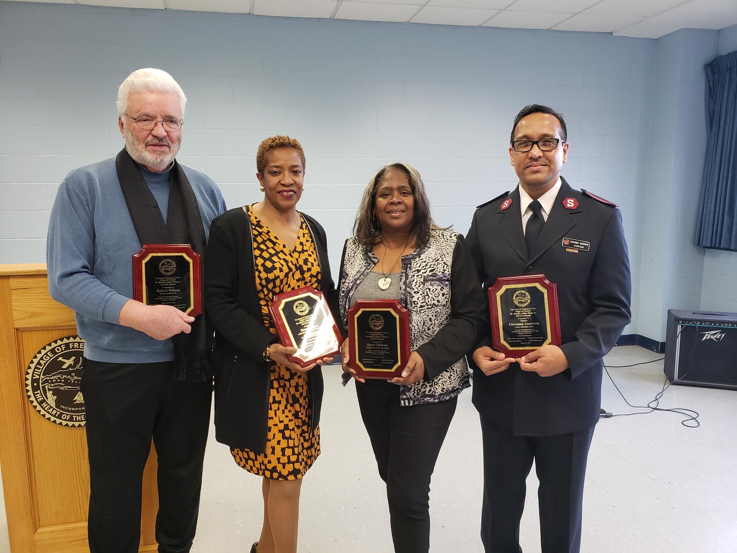 Four community-minded people — Robert Wilson, of the Freeport INN, far left; Sharon Payne and Hazel Gibbons, of the Stearns Park Civic Association; and Capt. Giovanny Guerrero, of the Freeport Salvation Army — were recognized for their contributions at the village’s Martin Luther King Jr. celebration at the Freeport Recreation Center on Jan. 19.