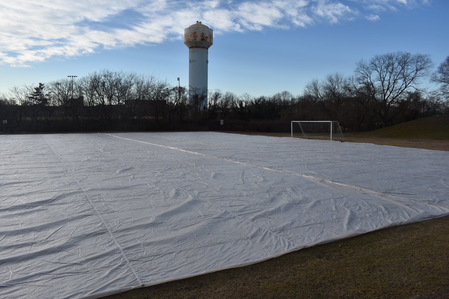 The field, which was covered with a tarp last week, will be able to be used year-round, according to Mayor Francis X. Murray, after artificial turf is installed later this year.