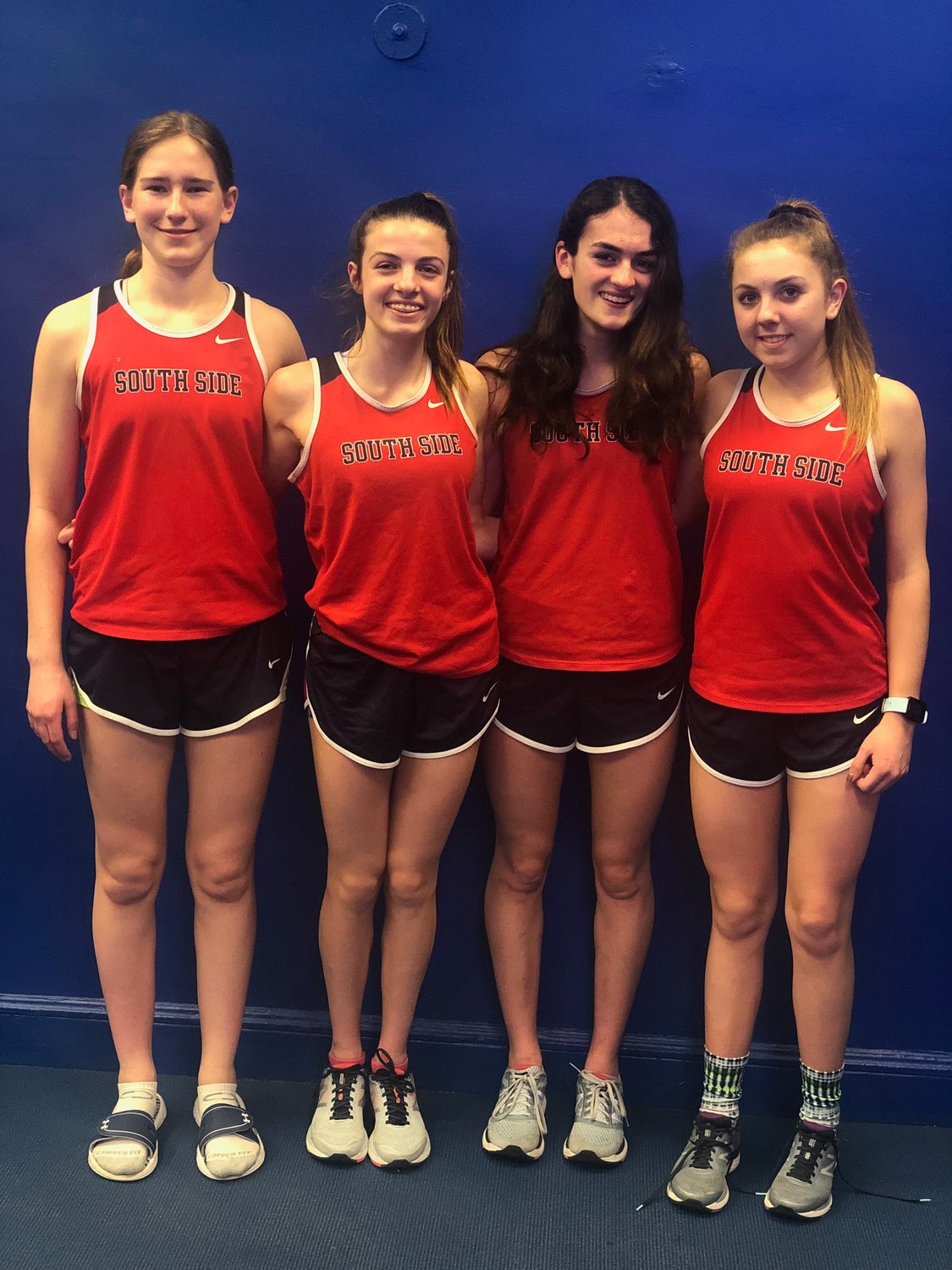Carly Woelfel, left, Olivia Duca, Avery Brull and Kaitlyn Mohr, were county champions in the 4x800-meter relay on Feb. 5.
