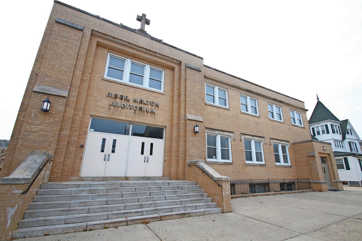 The auditorium at St. Agnes is named after the late Melton, who was one of three clergy accused of sexual abuse last week.