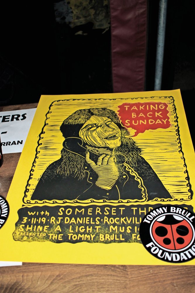 Posters, designed and printed by Rockville Centre native Dan Curran, were sold at the show.