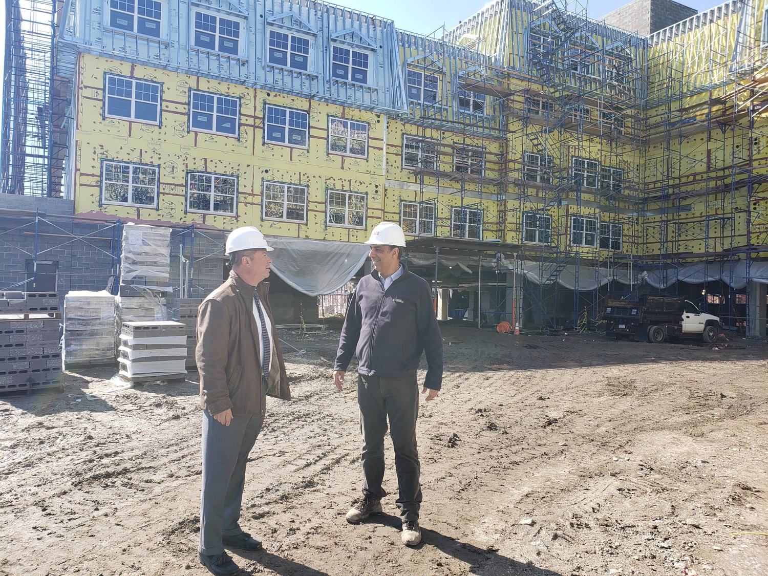 The Freeport Housing Authority’s executive director, John Hrvatin, left, chatted with Jobco’s project manager, Spiros Triantafyllou, about the progress on the new Moxey Rigby.