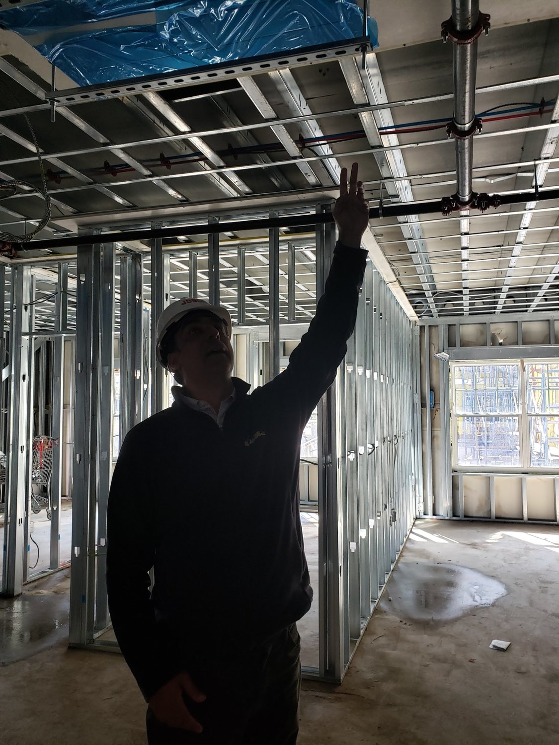 Jobco’s project manager, Spiros Triantafyllou, pointed at the central heating and air conditioning in one of the apartments under construction at the new Moxie Rigby in Freeport.