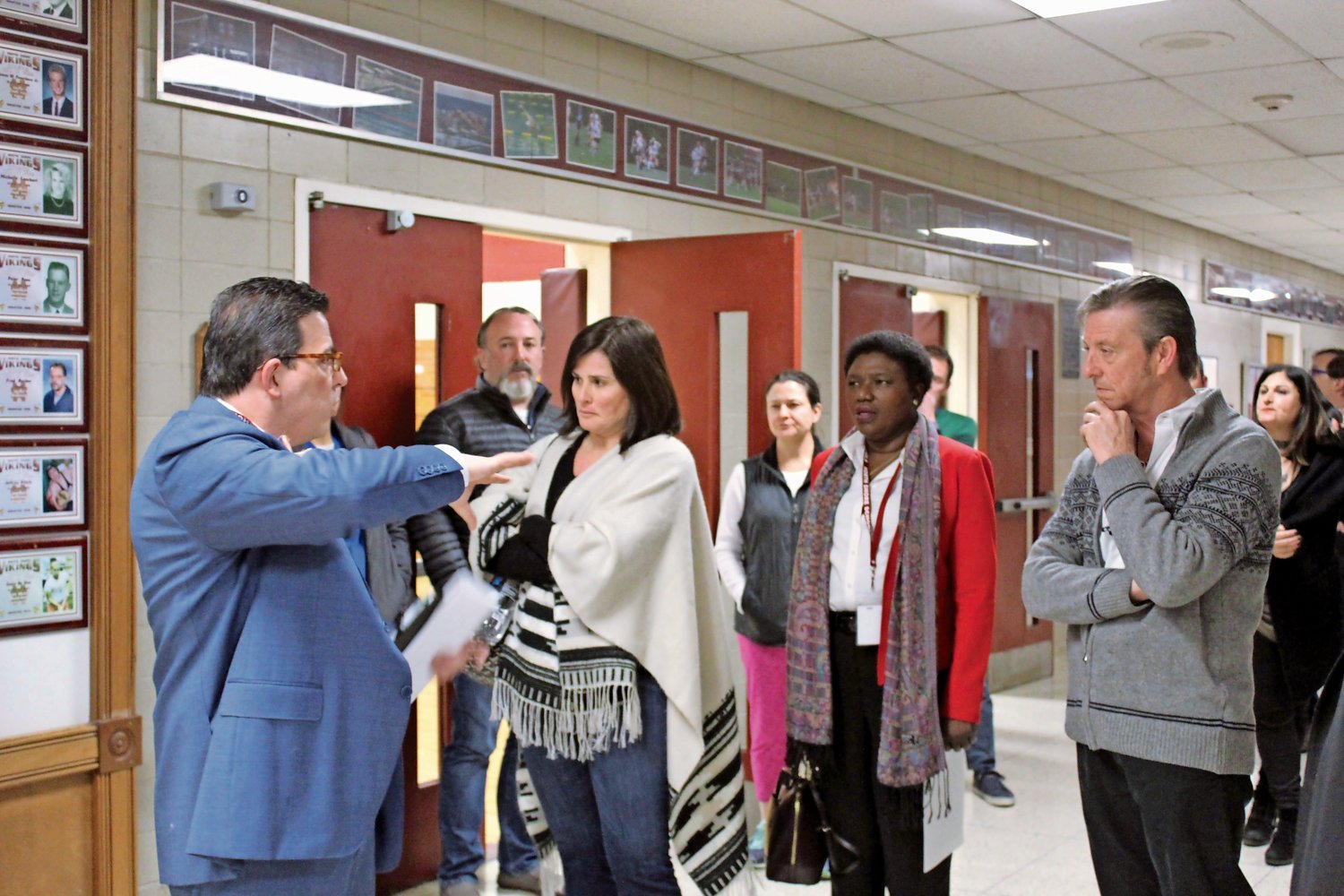 Superintendent Dr. Peter Giarrizzo, left, took community members on a tour of the district’s polling place for the annual budget vote and trustee election, which will be held, as in prior years, in the North Shore High School gym.