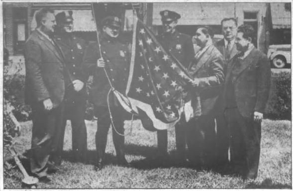 Fred Pieper, third from right, founded what went on to become the Oceanside Chamber of Commerce. Above, Pieper, on behalf of the Board of Trade, handed over a flag to a Nassau County patrolman that was flown on the Memorial Triangle.